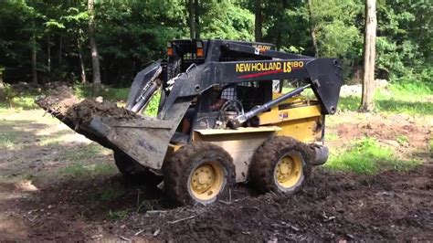 running a skid steer|excavating with a skid steer.